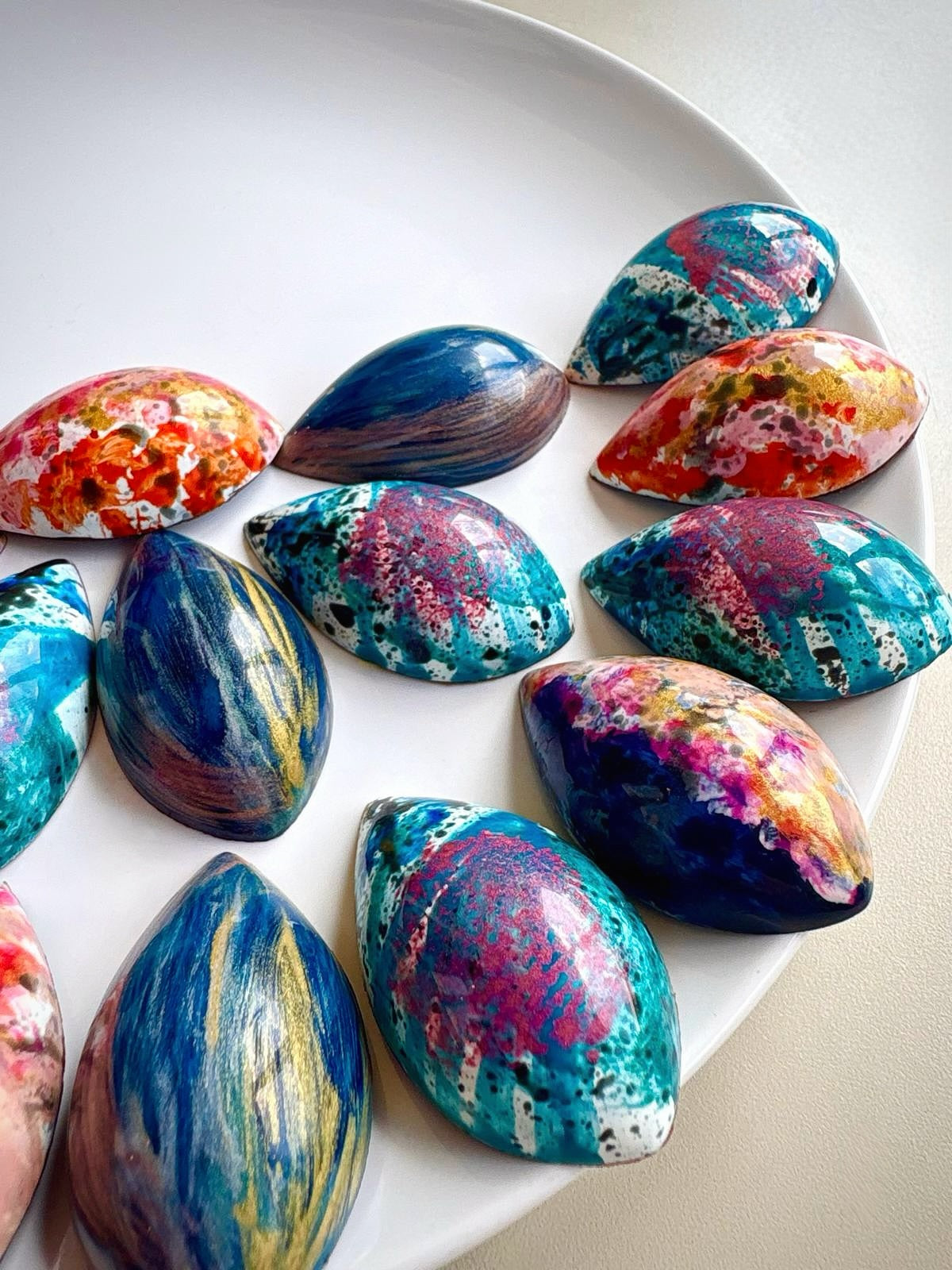 Dark chocolate marbled drops filled with  Colombian coffee ganache